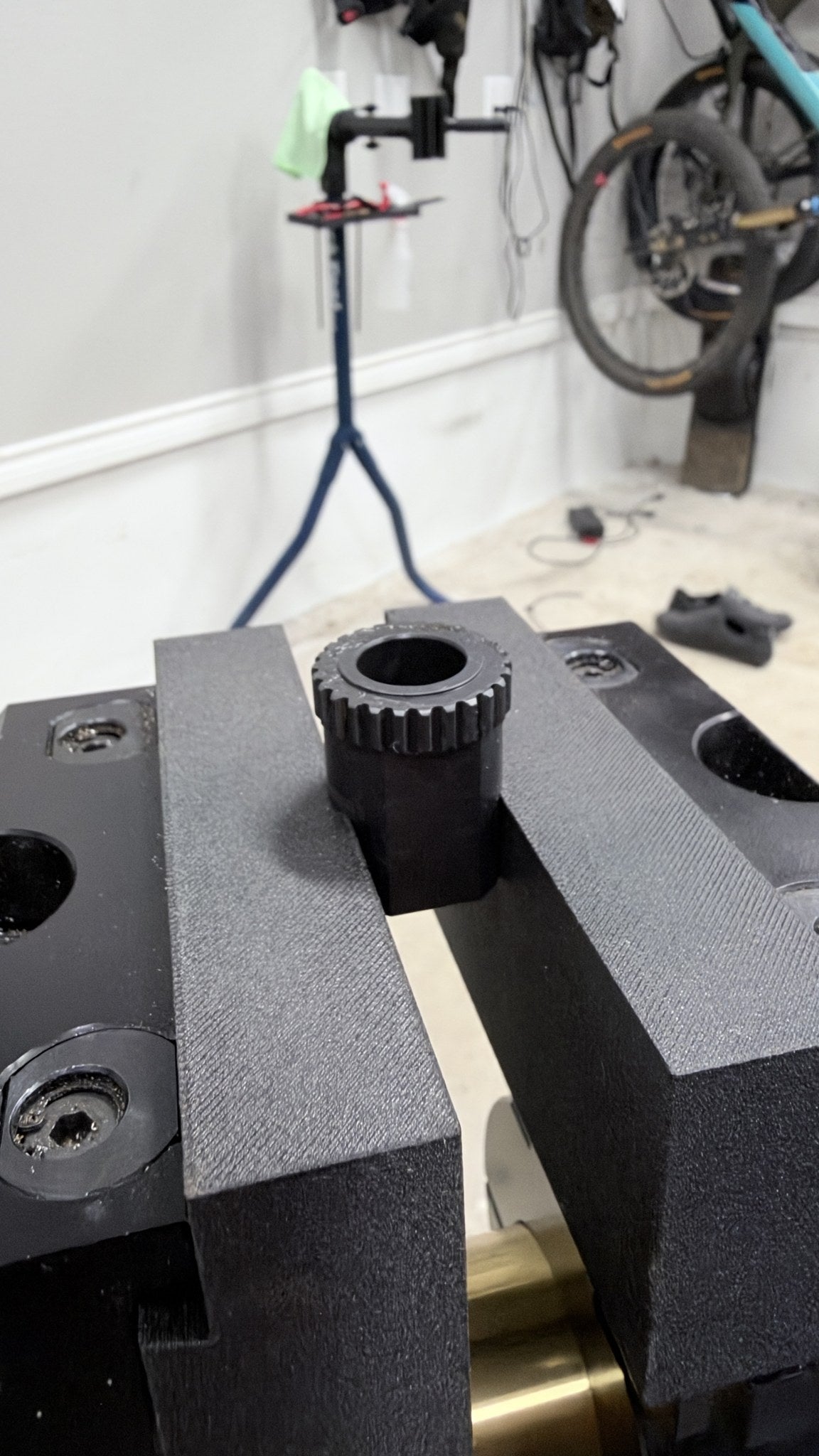ZED0 solid face soft jaws in an Orange bench vise holding a hub tool