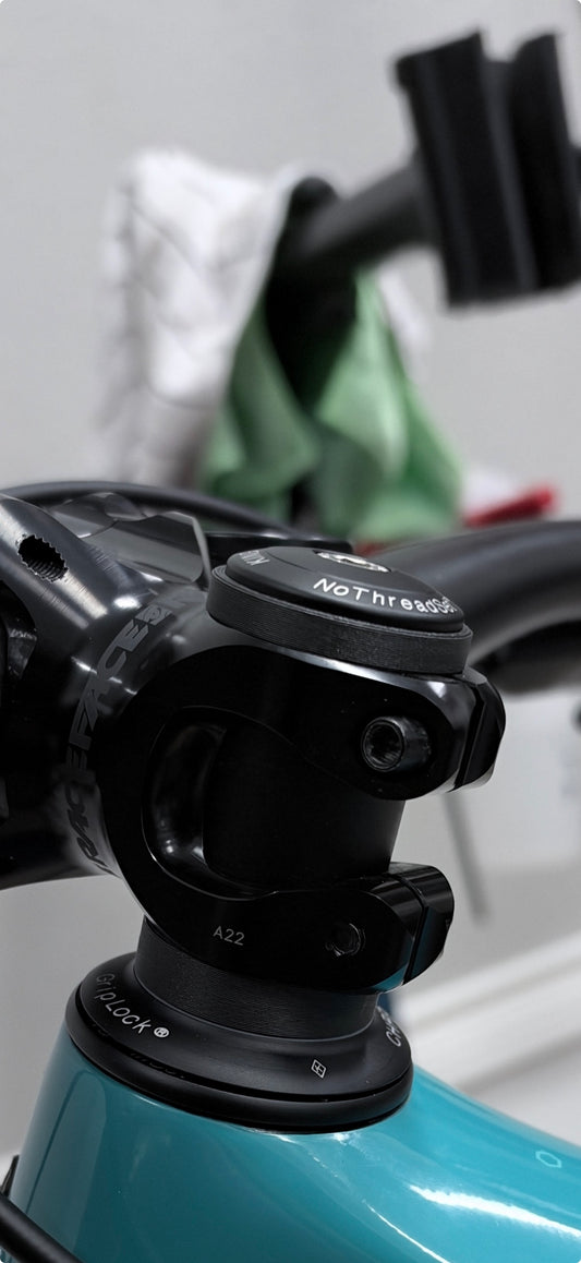 One-piece ZED0 stem riser under the stem on a bike with a GripLock headset